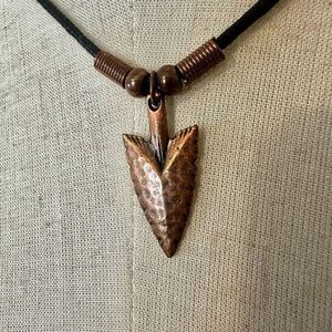 copper tone arrowhead pendant necklace on black cord